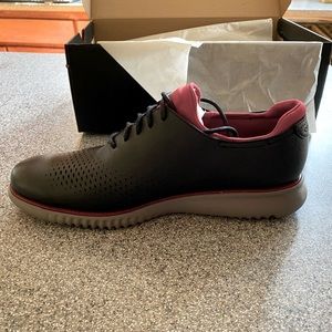 New in box Cole Haan Zerogrand men’s shoes grey/red/black color. Size 10.5